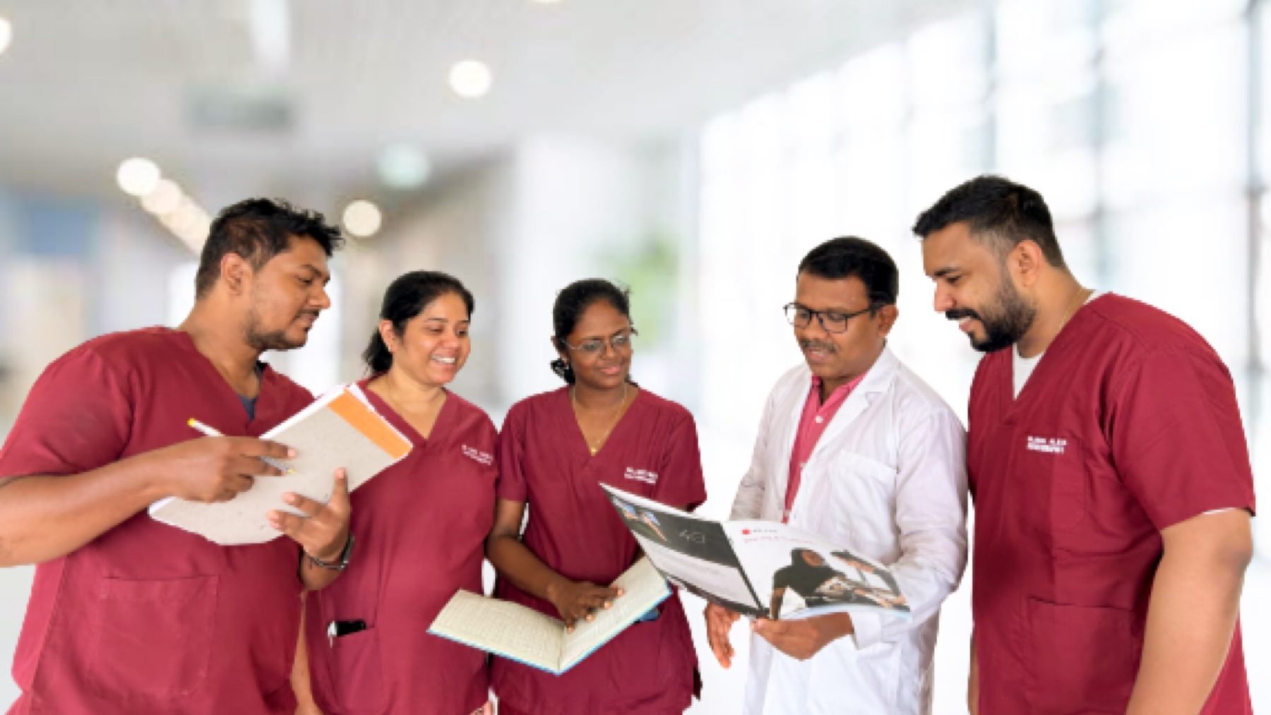 Faith Physical Therapy therapists reviewing a patient's imaging alongside a consultant at Bethany Hospital, Thane
